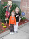 web_20051031-001girlsscarecrow.JPG (72234 bytes)